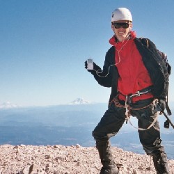 Aaron with his iPod on the summit of Mt. Hood